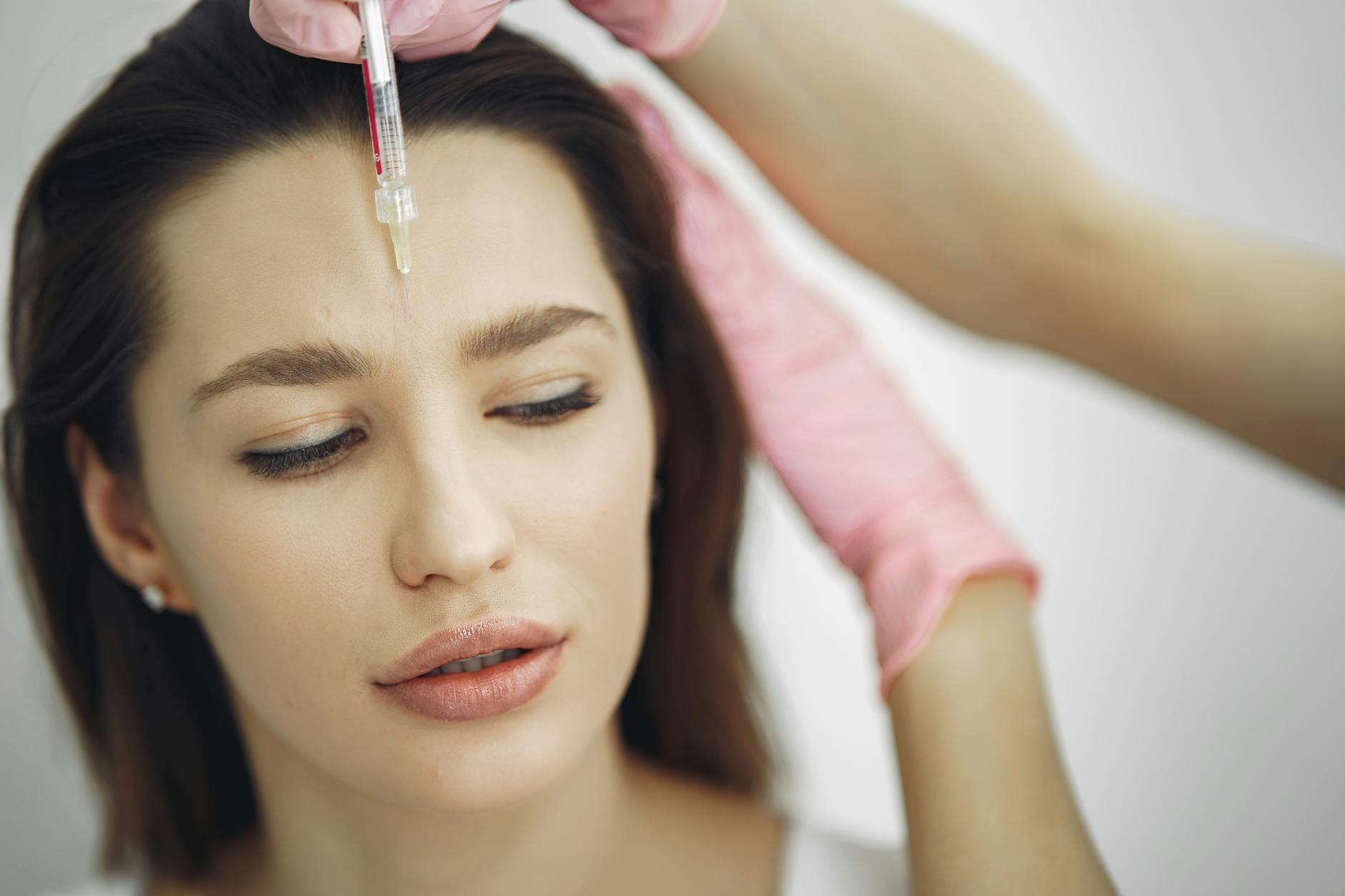 woman getting a face botox